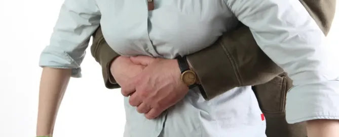 Man exercising Heimlich Maneuver demonstration