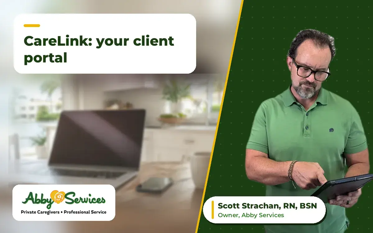Scott Strachan, RN, BSN, owner of Abby Services, using a tablet, with a laptop, phone and coffee mug on a kitchen table in the background