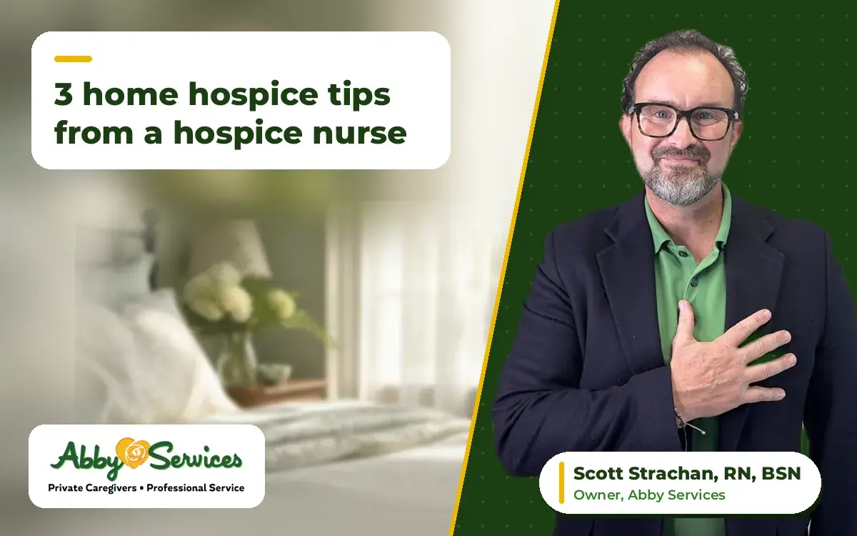 Scott Strachan, RN, BSN, owner of Abby Services, with his hand on his heart, with a peaceful bedroom with a quilt and fresh flowers in the background