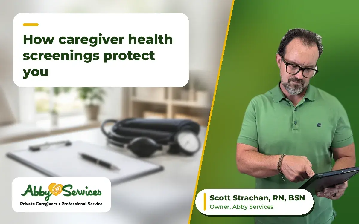 Scott Strachan, RN, BSN, owner of Abby Services, using a tablet, with a blood pressure cuff and clipboard on a table in the background