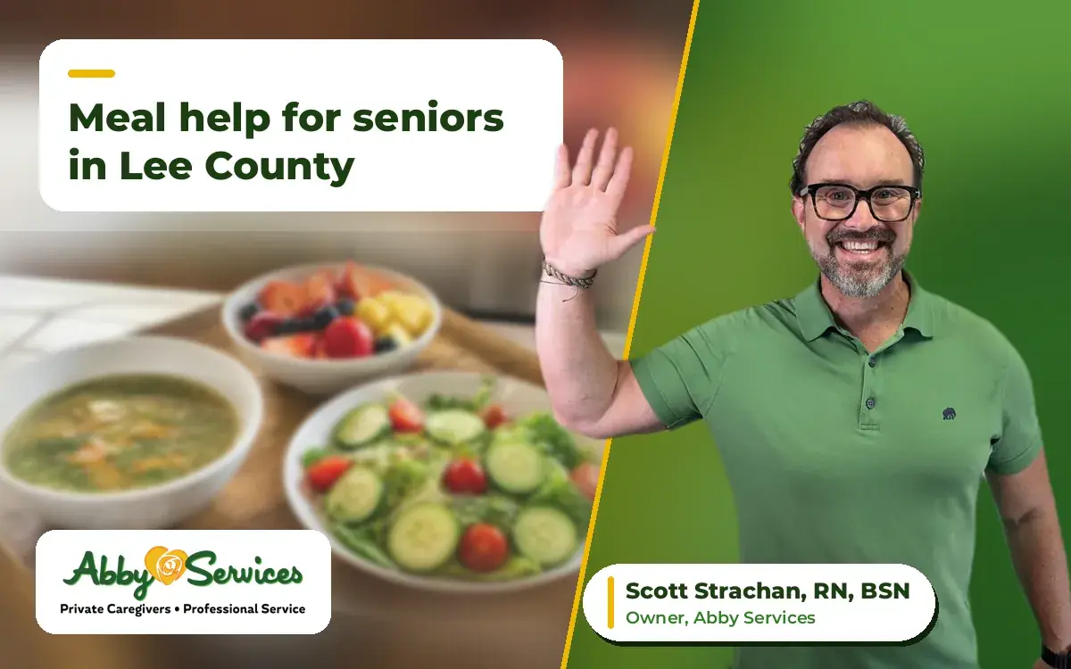 Scott Strachan, RN, BSN, owner of Abby Services, waving hello, with soup, salad and fruit on a meal tray in the background