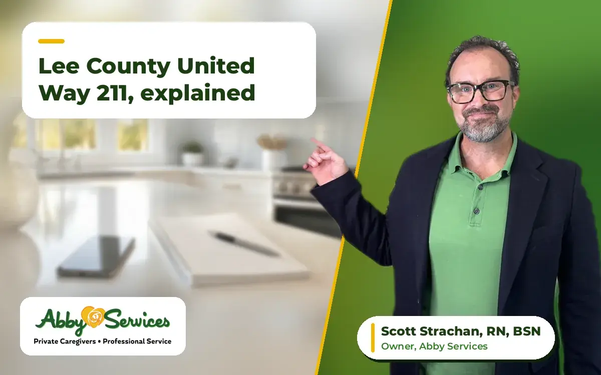 Scott Strachan, RN, BSN, owner of Abby Services, pointing to the article title, with a phone and a notepad on a kitchen counter in the background