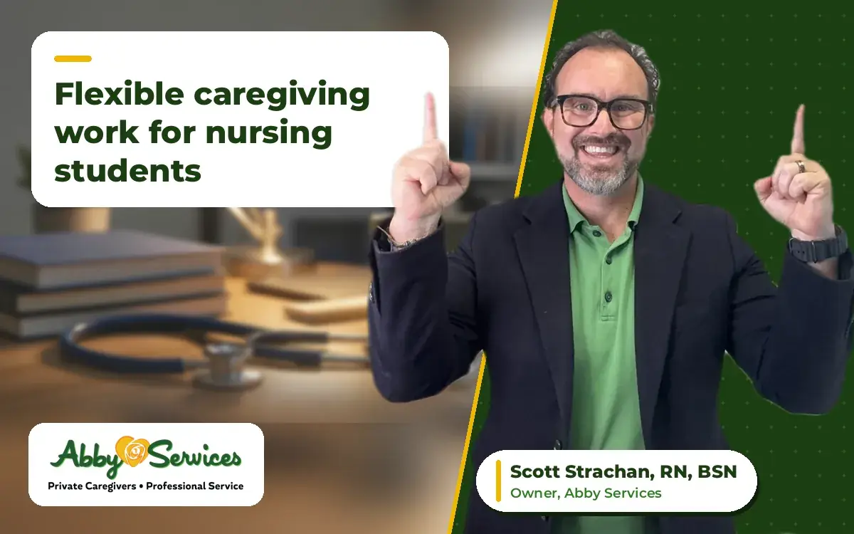 Scott Strachan, RN, BSN, owner of Abby Services, pointing up to the article title, with a study desk with a stethoscope, nursing textbooks and a coffee mug in the background