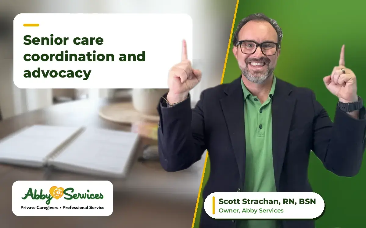 Scott Strachan, RN, BSN, owner of Abby Services, pointing up to the article title, with a weekly planner, pill organizer and reading glasses on a table in the background